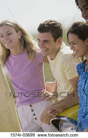 Stock Photo - Two teenage couples smiling. Fotosearch