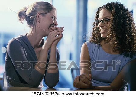 Stock Image - Two young women smiling. Fotosearch
