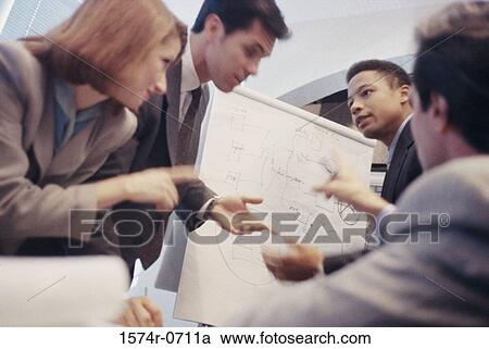 Stock Image - Business executives in a meeting. Fotosearch