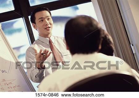 Stock Photograph - Business executives in a meeting. Fotosearch