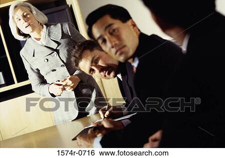 Stock Photograph - Business executives in an office. Fotosearch