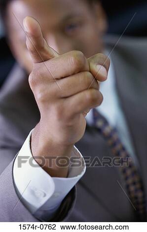 Stock Image - Businessman pointing with his finger. Fotosearch