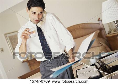 Stock Photo - Businessman talking on a telephone. Fotosearch