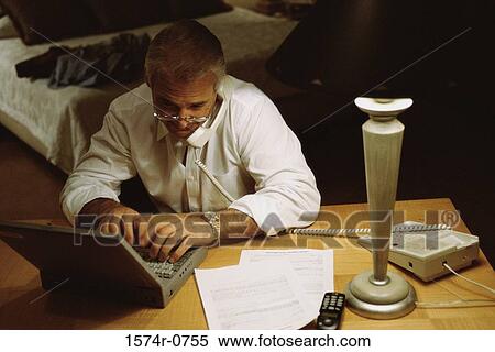 Businessman using a laptop View Large Photo Image Stock Photography - Businessman using a laptop. Fotosearch