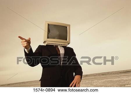 Picture - Businessman with a computer monitor for a head. Fotosearch