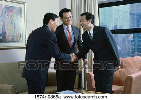 Stock Image - Businessmen shaking hands. Fotosearch