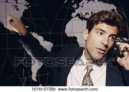Stock Image - Close-up of a businessman talking on a mobile phone. Fotosearch