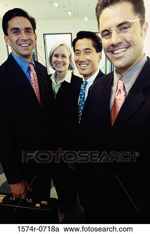 Portrait of a group of business executives smiling View Large Photo Image Stock Image - Portrait of a group of business executives smiling. Fotosearch