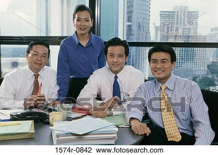 Portrait of a group of business executives in an office View Large Photo Image Stock Image - Portrait of a group of business executives in an office. Fotosearch
