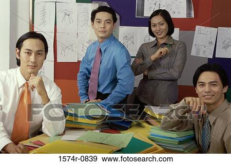 Portrait of a group of young business executives in an office View Large Photo Image Stock Photo - Portrait of a group of young business executives in an office. Fotosearch