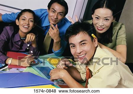 Portrait of a group of young business executives in an office View Large Photo Image Stock Photo - Portrait of a group of young business executives in an office. Fotosearch
