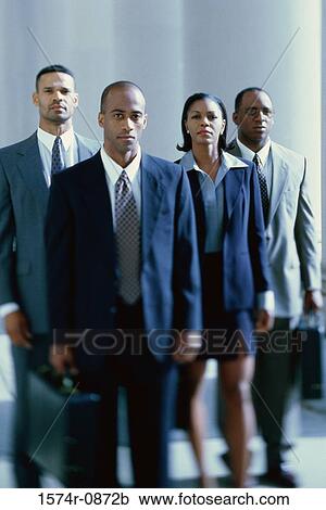 Portrait of business executives standing together View Large Photo Image Stock Image - Portrait of business executives standing together. Fotosearch