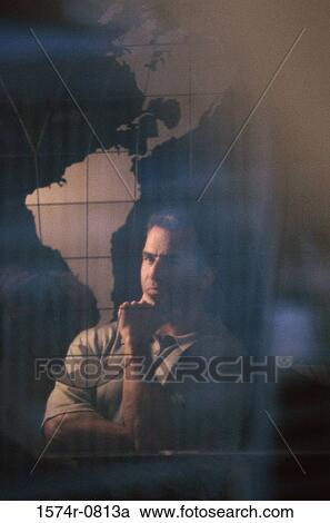 Stock Image - Reflection of a man in glass. Fotosearch