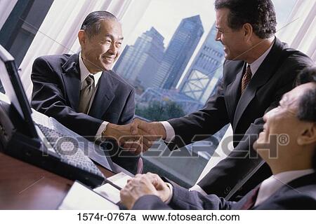 Two businessmen shaking hands View Large Photo Image Stock Image - Two businessmen shaking hands. Fotosearch