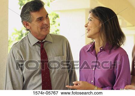 Businessman and a businesswoman talking View Large Photo Image Stock Photo - Businessman and a businesswoman talking. Fotosearch