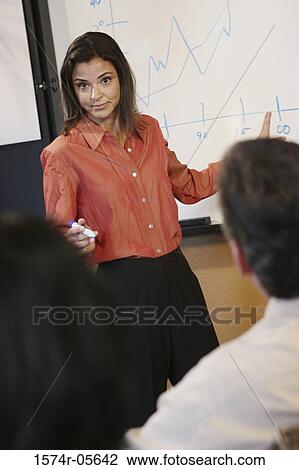 Businesswoman giving a presentation View Large Photo Image Stock Image - Businesswoman giving a presentation. Fotosearch