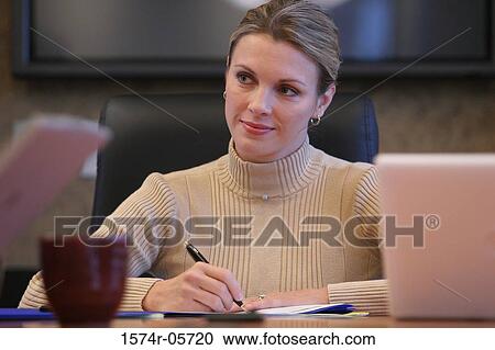 Close-up of a businesswoman sitting in a conference room View Large Photo Image Stock Image - Close-up of a businesswoman sitting in a conference room. Fotosearch