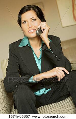 Stock Photo - Close-up of a businesswoman using a mobile phone. Fotosearch