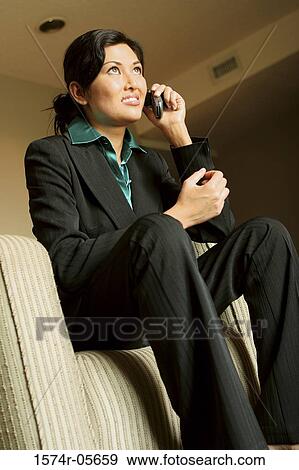 Close-up of a businesswoman using a mobile phone View Large Photo Image Stock Photo - Close-up of a businesswoman using a mobile phone. Fotosearch