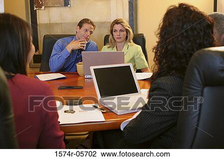 Group of business executives sitting in a conference room View Large Photo Image Stock Image - Group of business executives sitting in a conference room. Fotosearch