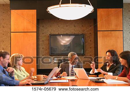 Group of business executives sitting in a conference room View Large Photo Image Stock Photo - Group of business executives sitting in a conference room. Fotosearch