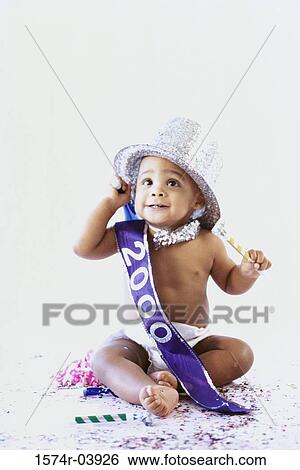Stock Photograph - Baby boy wearing a hat looking up. Fotosearch
