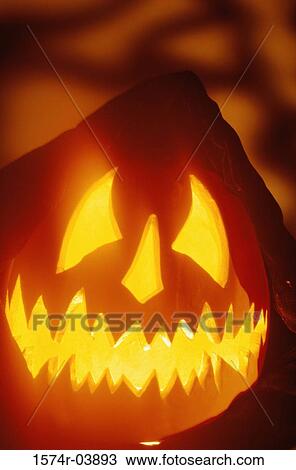 Stock Image - Close-up of a carved jack-o-lantern. Fotosearch
