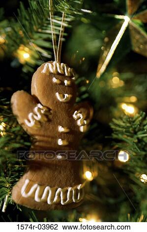 Stock Image - Close-up of a gingerbread cookie on a Christmas tree. Fotosearch