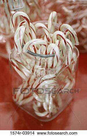 Close-up of a jar of candy canes View Large Photo Image Picture - Close-up of a jar of candy canes. Fotosearch