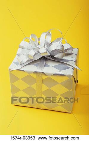 Close-up of a wrapped gift View Large Photo Image Stock Image - Close-up of a wrapped gift. Fotosearch
