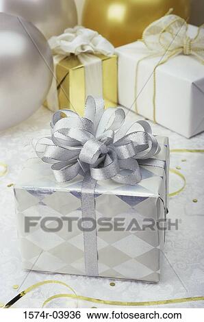 Close-up of a wrapped gift View Large Photo Image Stock Photograph - Close-up of a wrapped gift. Fotosearch