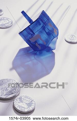 Close-up of coins and Hebrew script on a dreidel View Large Photo Image Stock Photography - Close-up of coins and Hebrew script on a dreidel. Fotosearch