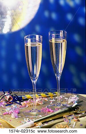 Close-up of two champagne flutes on a table View Large Photo Image Stock Image - Close-up of two champagne flutes on a table. Fotosearch