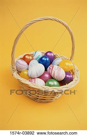 Stock Image - Easter eggs in an Easter basket. Fotosearch