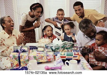Family celebrating a birthday party View Large Photo Image Stock Image - Family celebrating a birthday party. Fotosearch