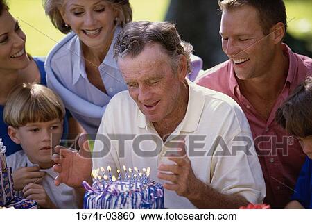 Family celebrating a birthday party View Large Photo Image Stock Image - Family celebrating a birthday party. Fotosearch