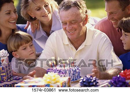 Family celebrating a birthday party View Large Photo Image Stock Image - Family celebrating a birthday party. Fotosearch
