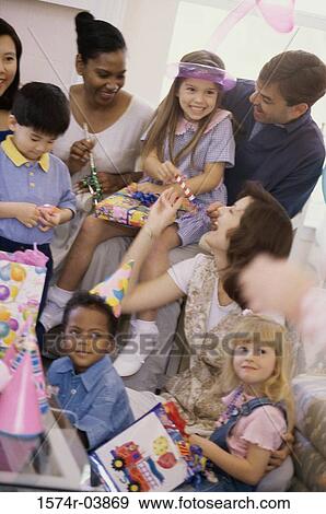 Group of children and their parents at a birthday party View Large Photo Image Stock Photo - Group of children and their parents at a birthday party. Fotosearch