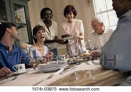 Group of people celebrating a dinner party View Large Photo Image Stock Image - Group of people celebrating a dinner party. Fotosearch