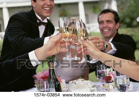 Group of people toasting with glasses of champagne View Large Photo Image Picture - Group of people toasting with glasses of champagne. Fotosearch