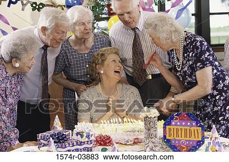 Group of senior people celebrating at a birthday party View Large Photo Image Stock Image - Group of senior people celebrating at a birthday party. Fotosearch