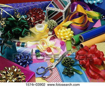 High angle view of ribbons with wrapping paper and a pair of scissors View Large Photo Image Stock Image - High angle view of ribbons with wrapping paper and a pair of scissors. Fotosearch