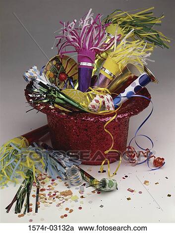 Noisemakers and confetti with a party hat View Large Photo Image Stock Image - Noisemakers and confetti with a party hat. Fotosearch