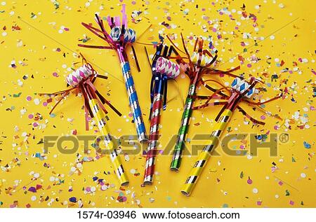 Stock Photograph - Party horn blowers and confetti. Fotosearch
