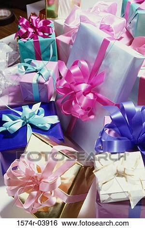 Pile of wrapped gifts with bows View Large Photo Image Stock Photograph - Pile of wrapped gifts with bows. Fotosearch