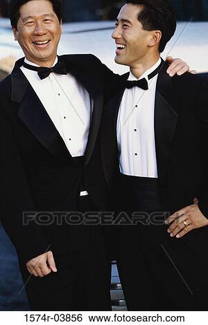 Portrait of a father standing with his son View Large Photo Image Stock Photograph - Portrait of a father standing with his son. Fotosearch