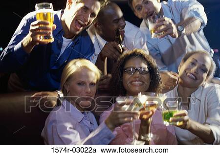 Portrait of three young couples toasting with glasses View Large Photo Image Stock Image - Portrait of three young couples toasting with glasses. Fotosearch