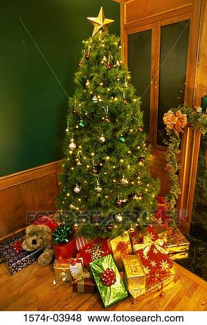 Presents under a Christmas tree View Large Photo Image Stock Photo - Presents under a Christmas tree. Fotosearch