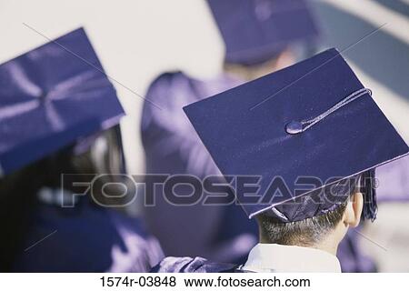 Stock Photo - Rear view of young graduates. Fotosearch