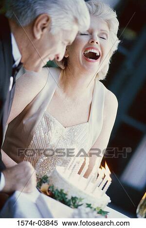 Senior couple with a birthday cake View Large Photo Image Stock Photography - Senior couple with a birthday cake. Fotosearch